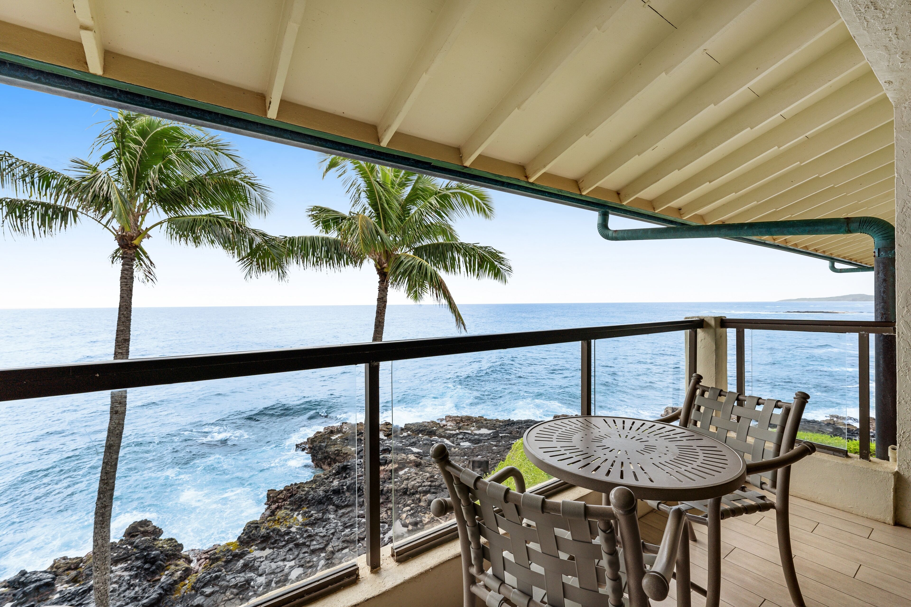 Updated waterfront condo with ocean views, heated pool, & private lanai