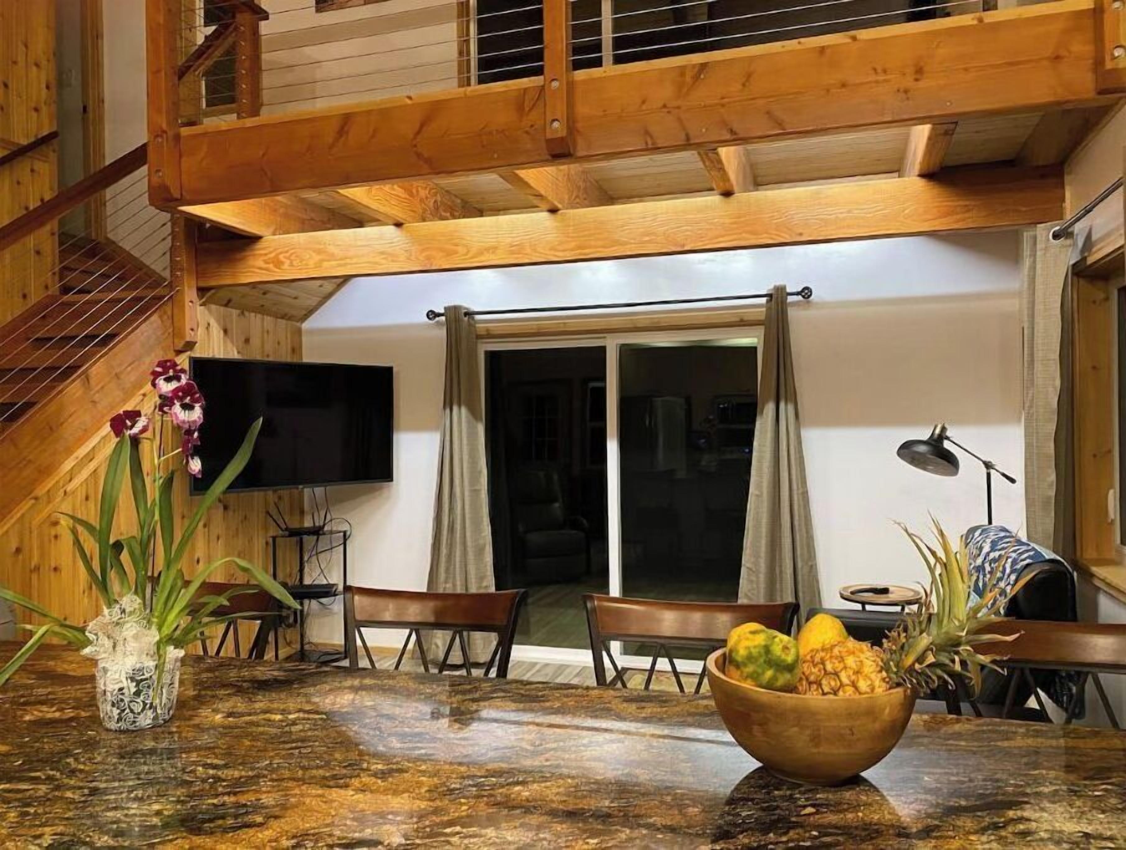 Custom cottage feels bright & airy yet cozy and private in this country setting.