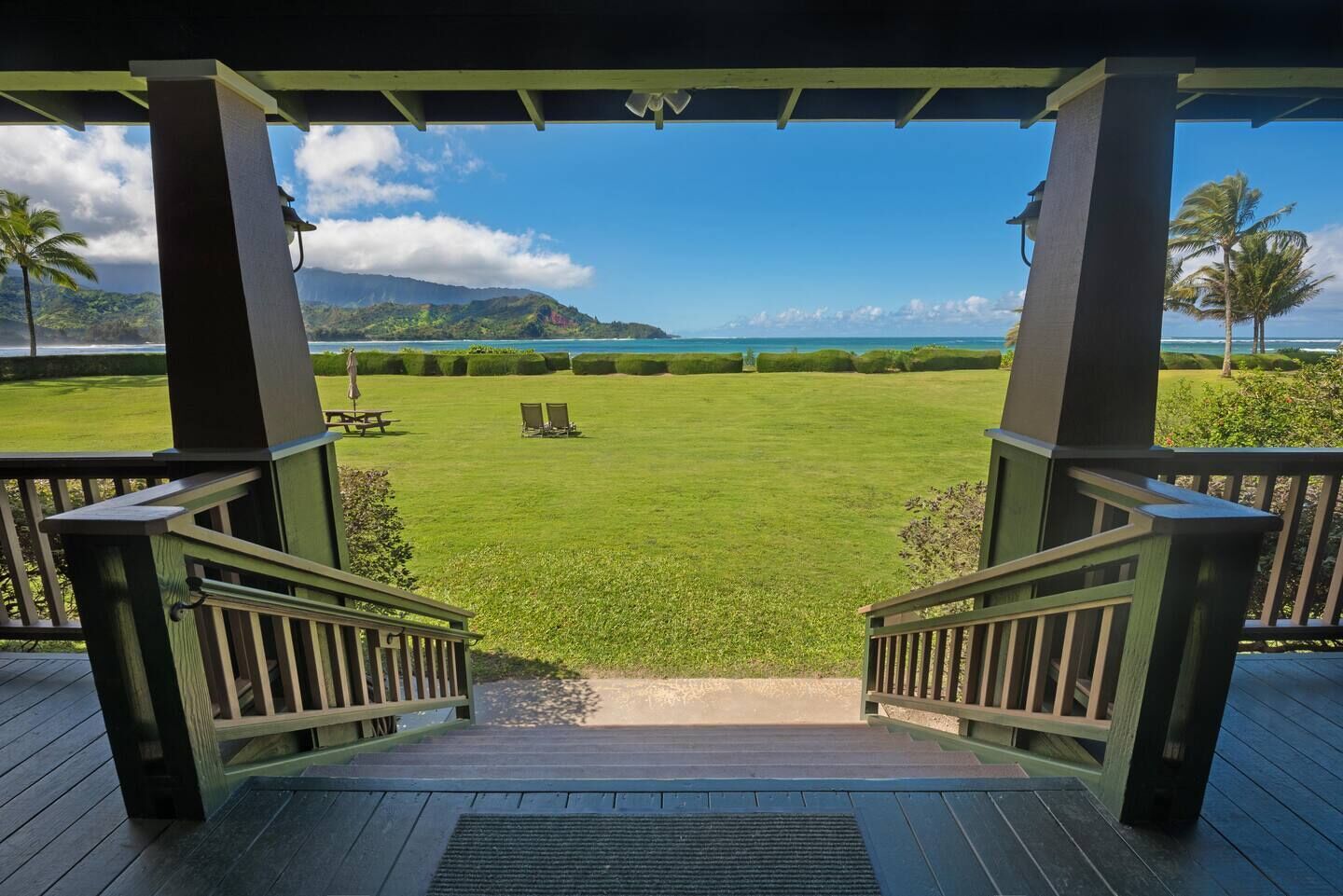 This beautiful beachfront Hanalei Bay home is located steps from the sand