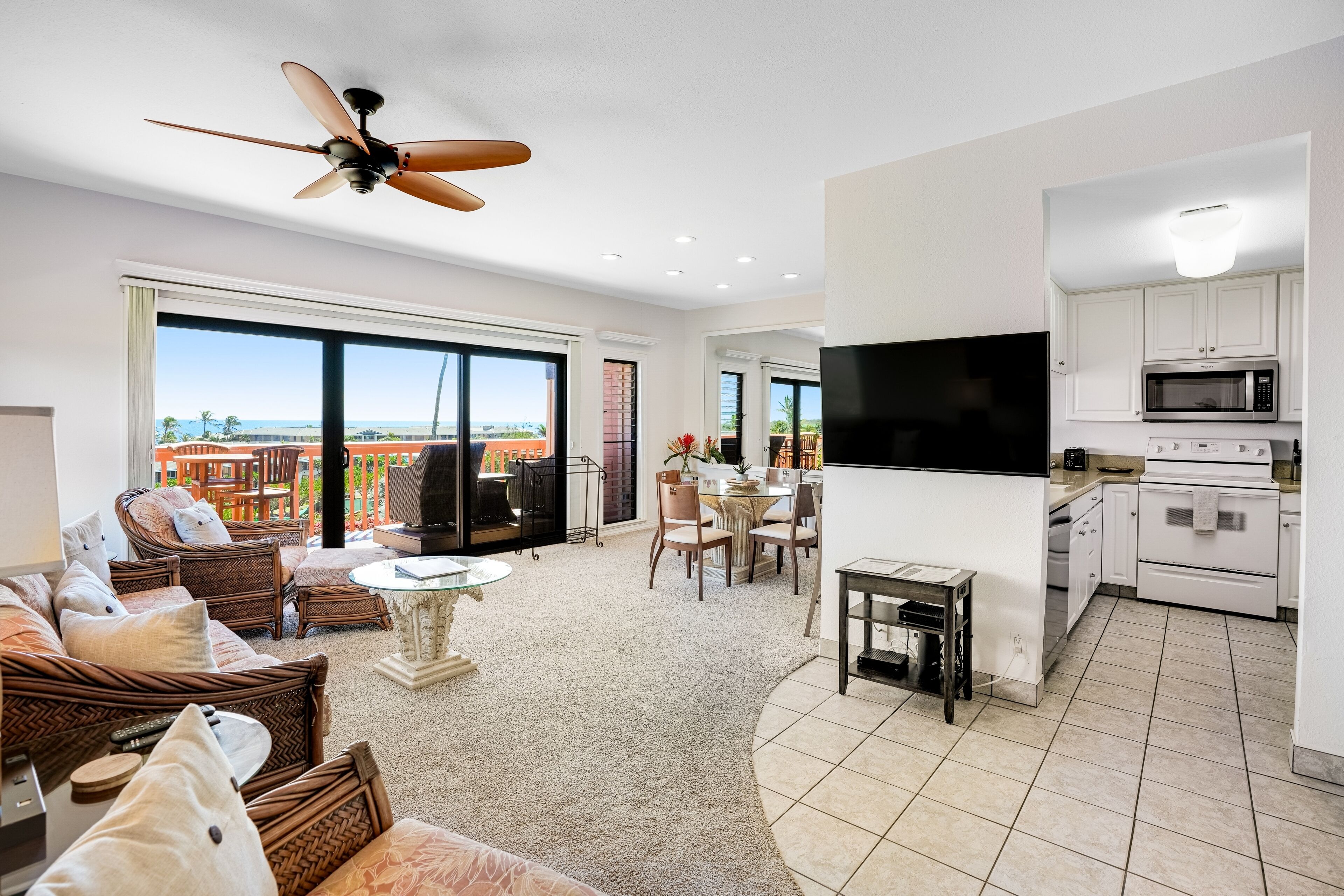 Condo with expansive ocean views from the kitchen, lanai & primary suite
